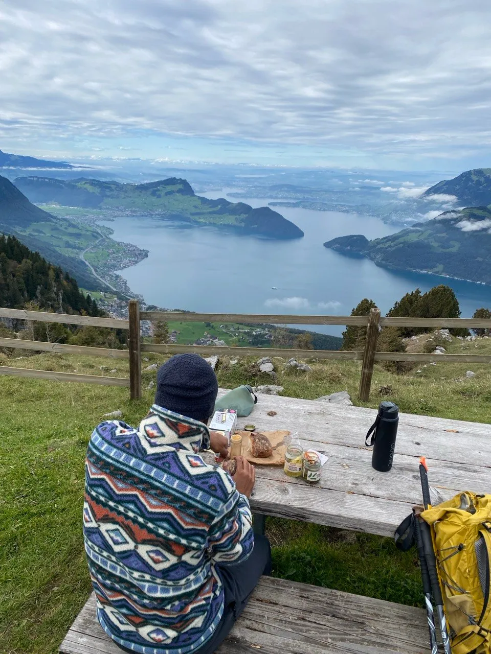 Picnic at a trailside table overlooking the lake, bundled up in warm layers.
