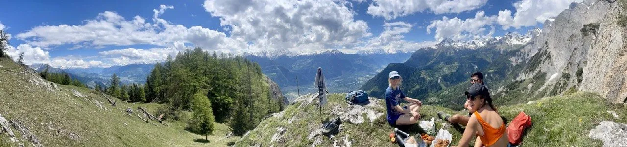 Picnic break with a panoramic view over the Rhone valley and surrounding peaks.