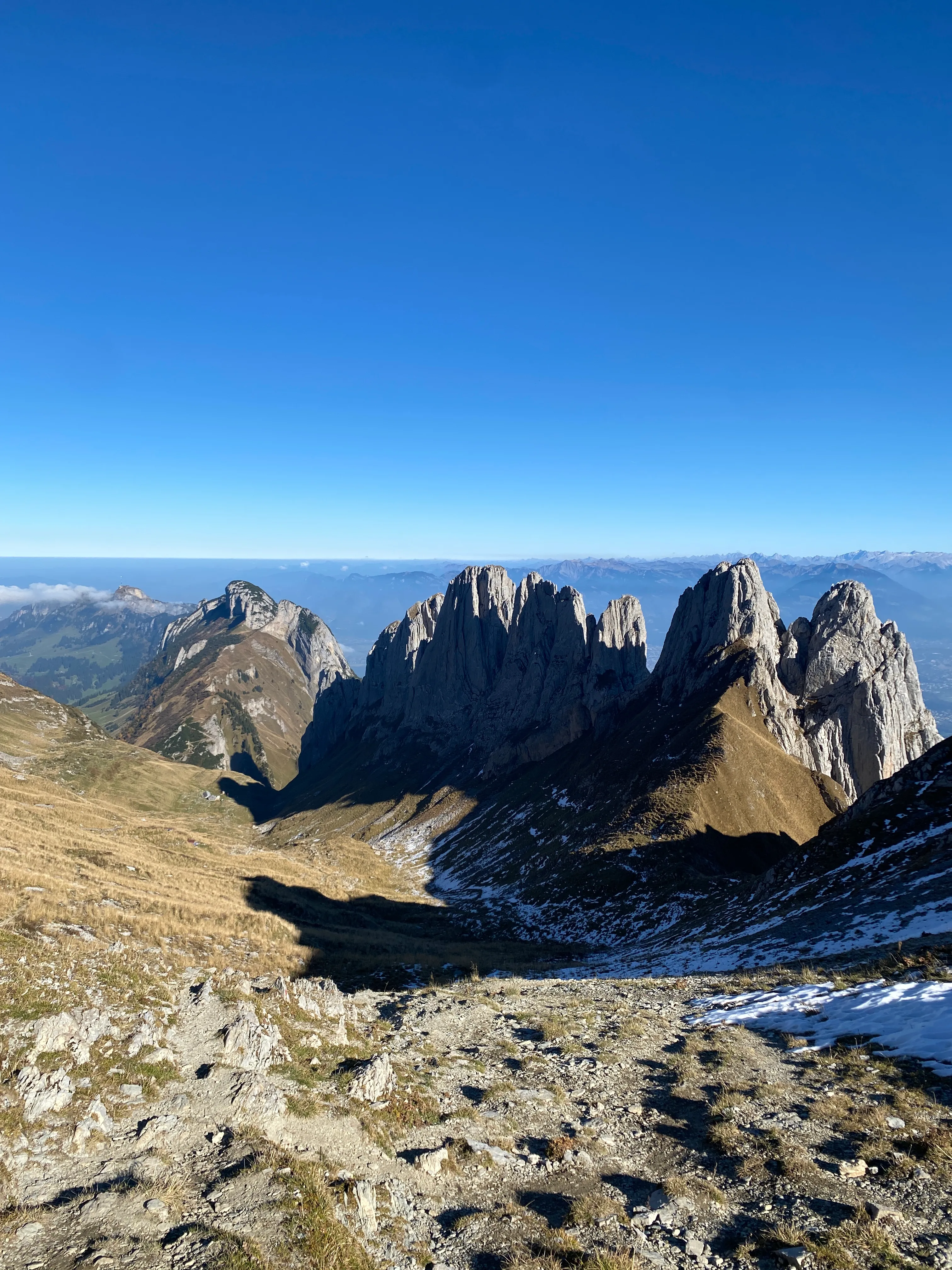 The jagged Kreuzberge above an autumn valley, a little leftover snow on the ridge.