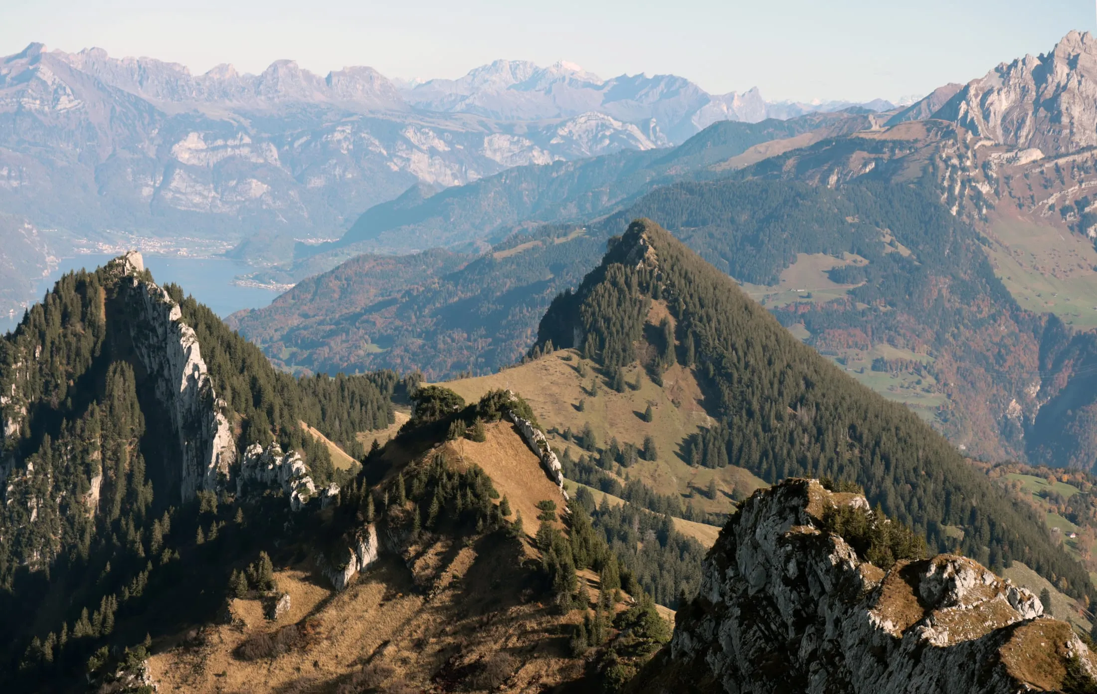 Jagged limestone ridge with the Mythen and Walensee on the horizon.