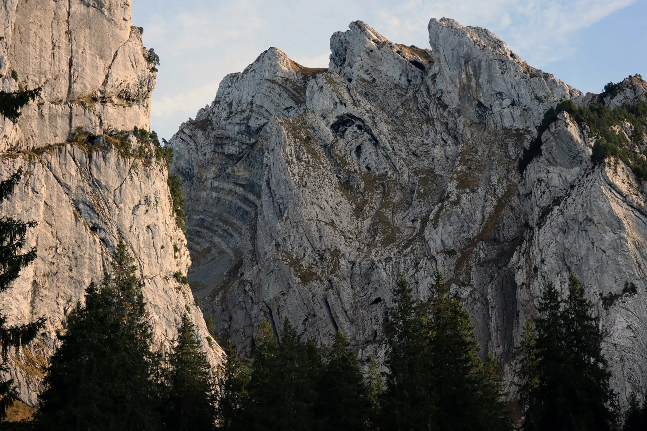 Spectacularly folded limestone face with clearly visible bedding.