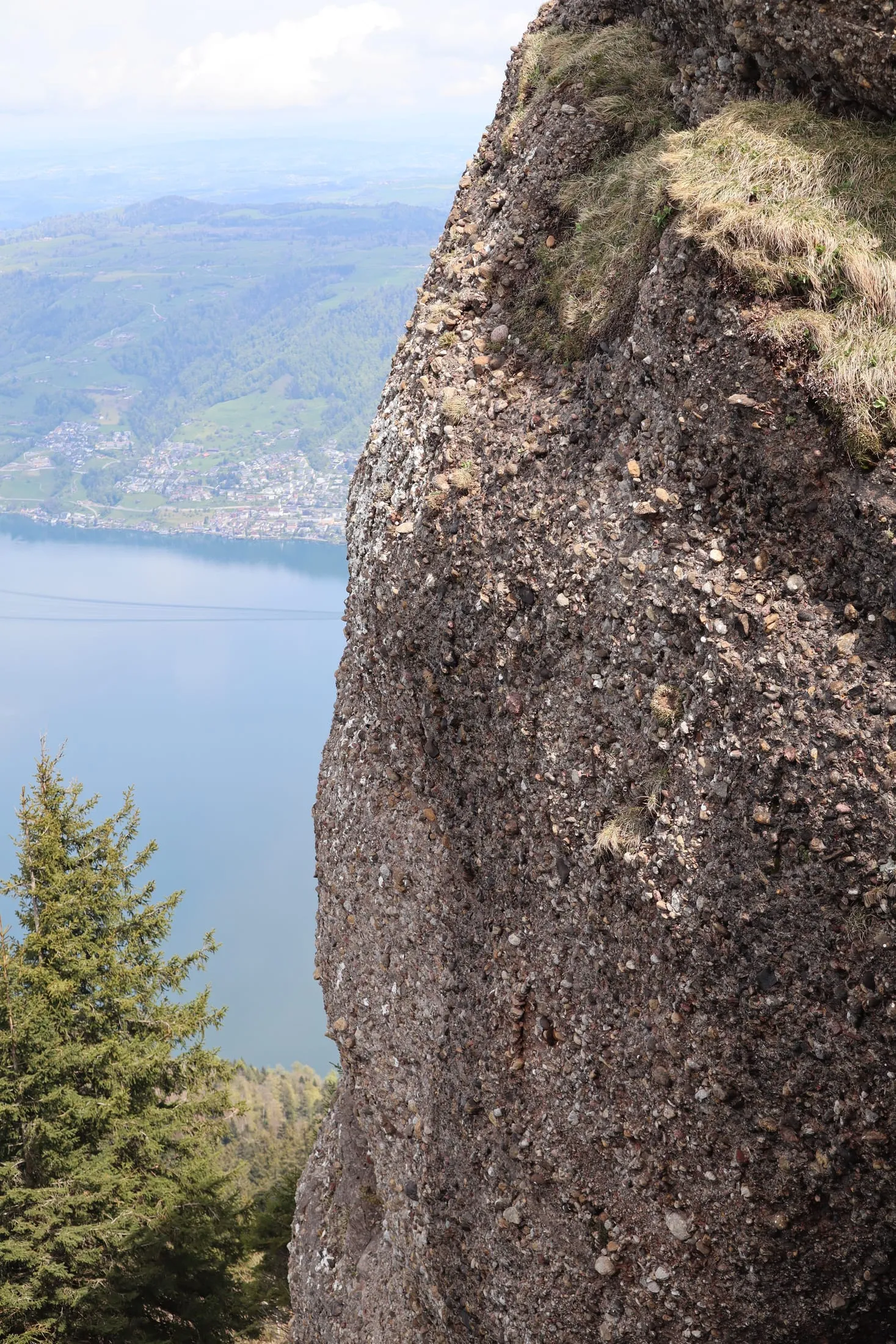 Conglomerate rock on the Nordwestrippe with the valley and lake below.