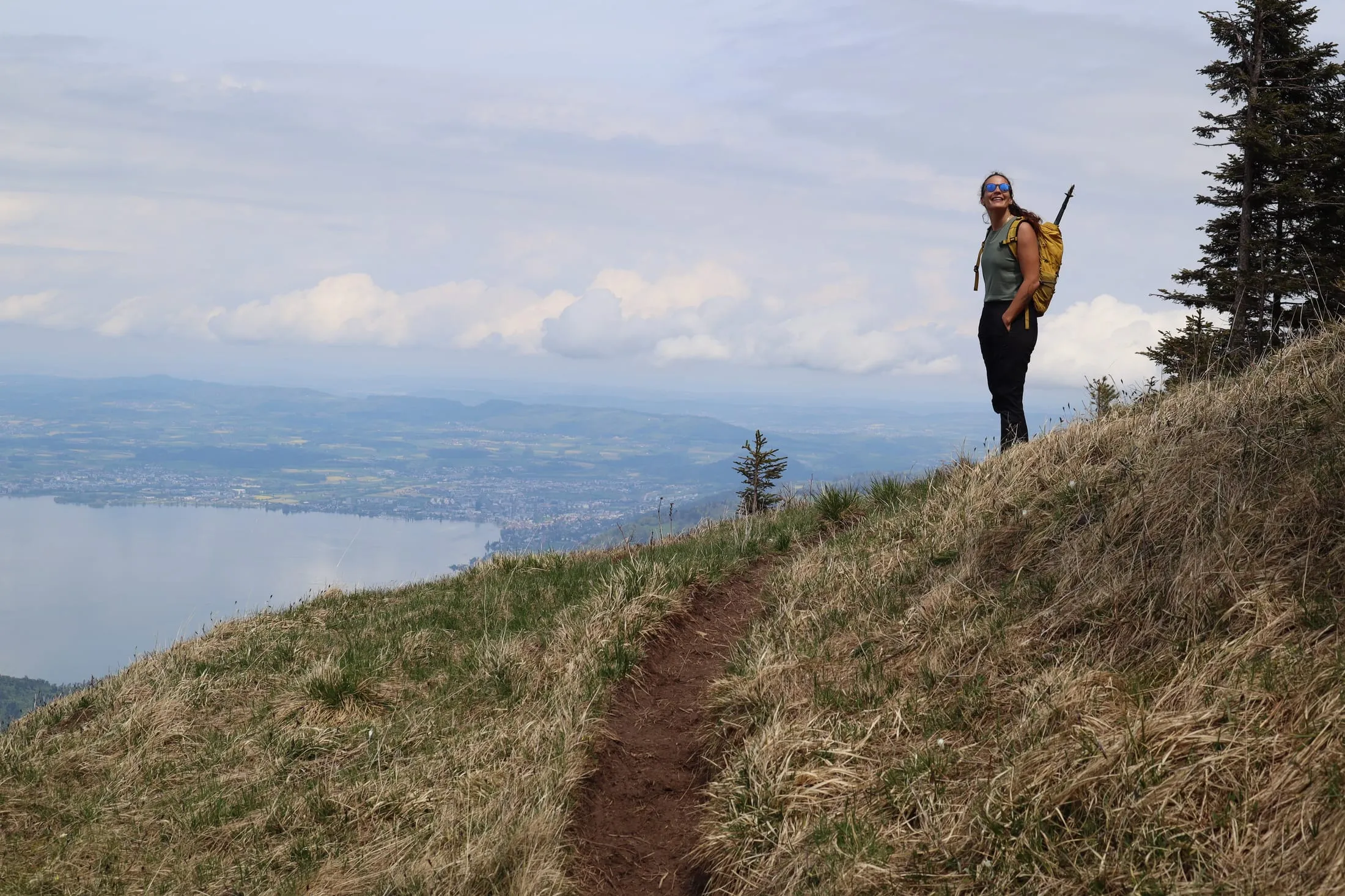 Hiker on the narrow Nordwestrippe trail with the lake far below.