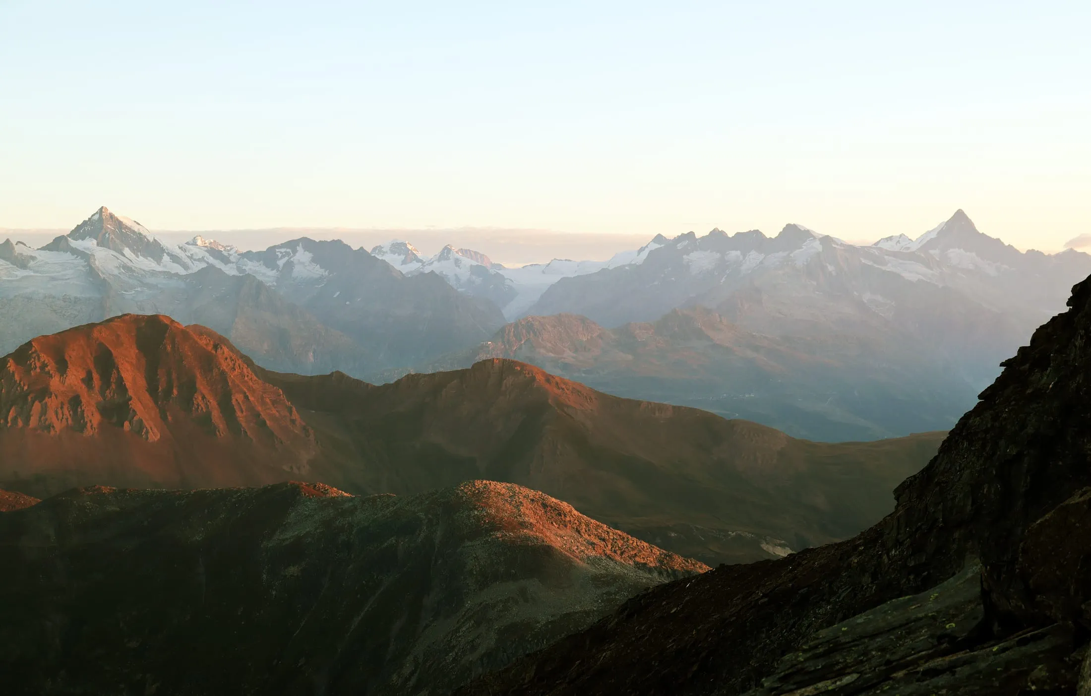 Alpenglow on the ridges below the Bortelhorn with the Walliser Alpen on the horizon.