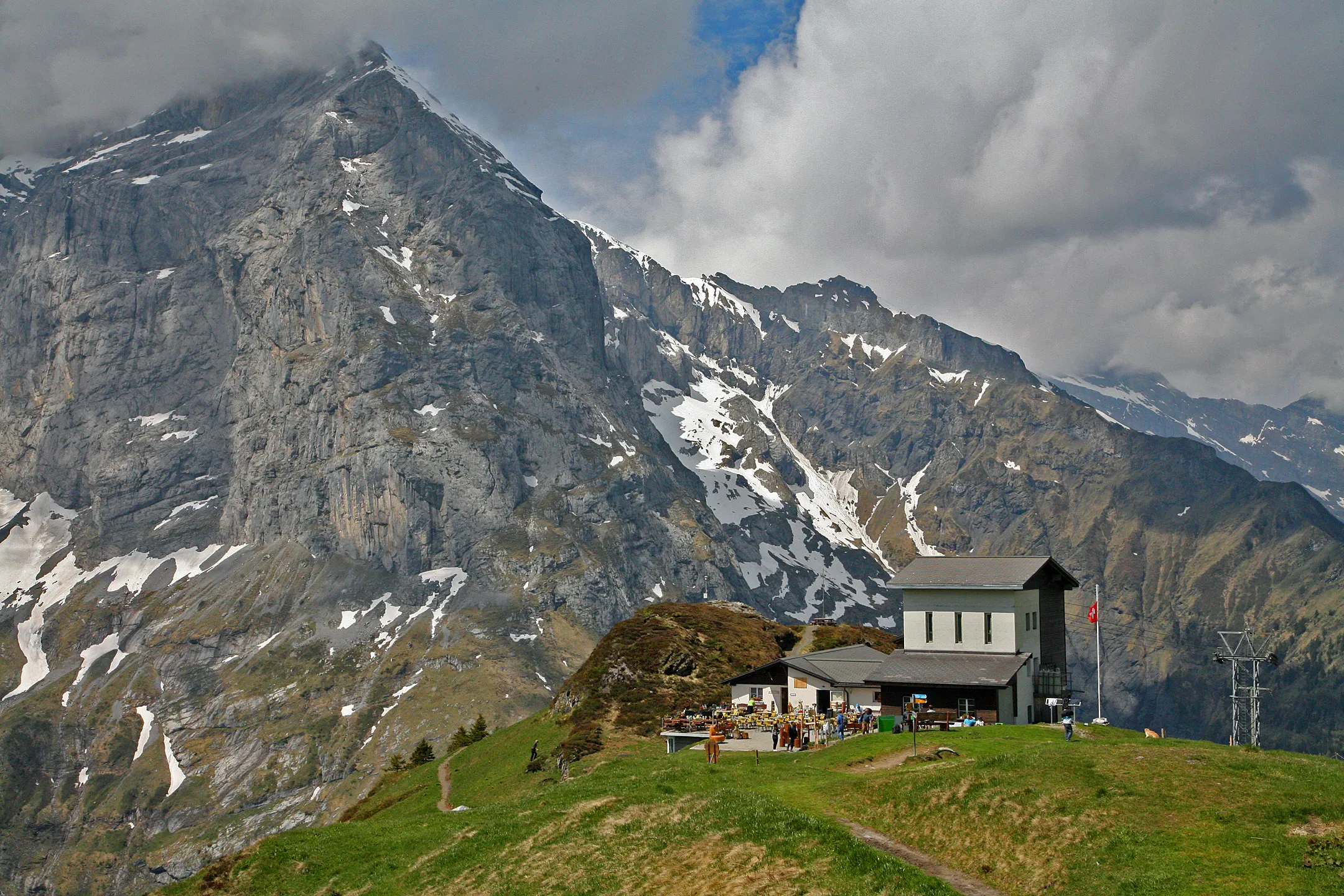 The mountain restaurant and top station of the Fürenalp cable car above Engelberg, with the 3000-metre peaks of the Engelberg valley behind.