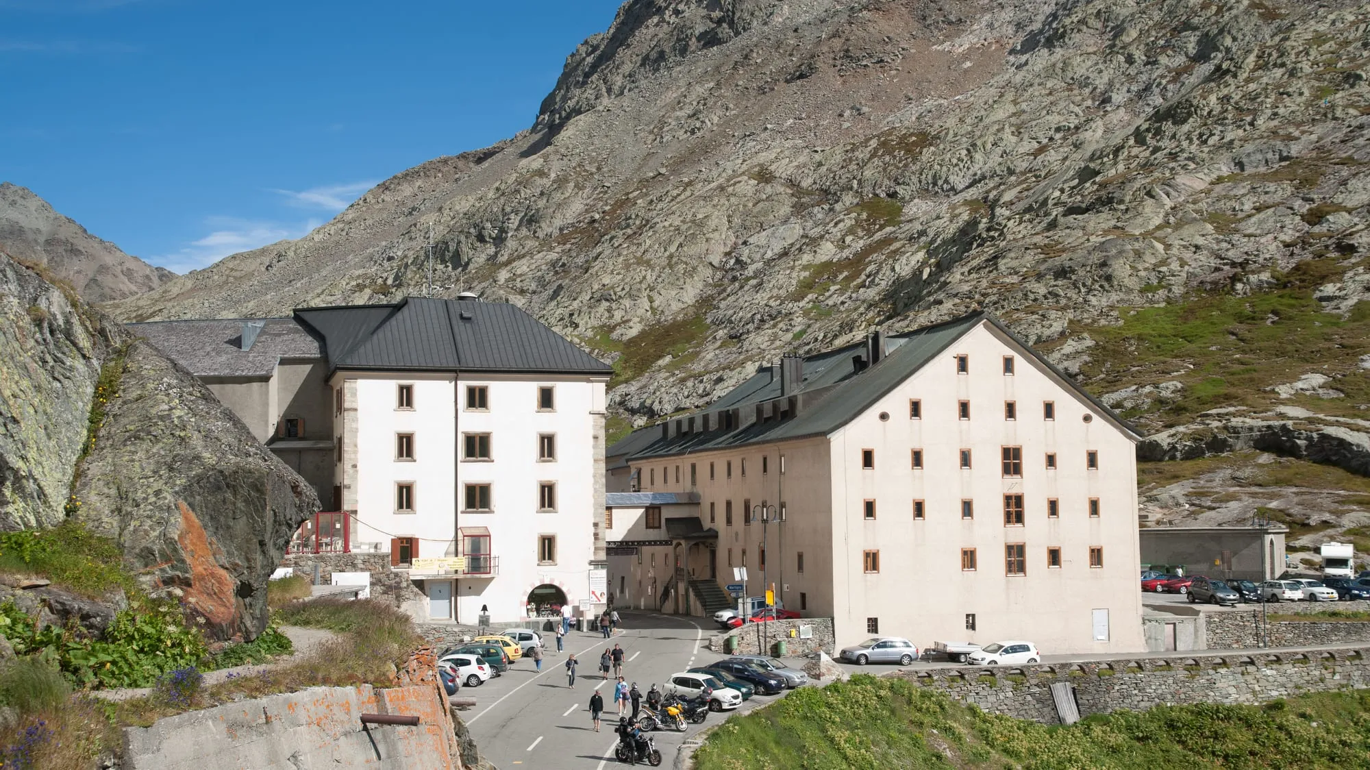 The Grand-Saint-Bernard hospice buildings beside its small pass-top lake in summer.