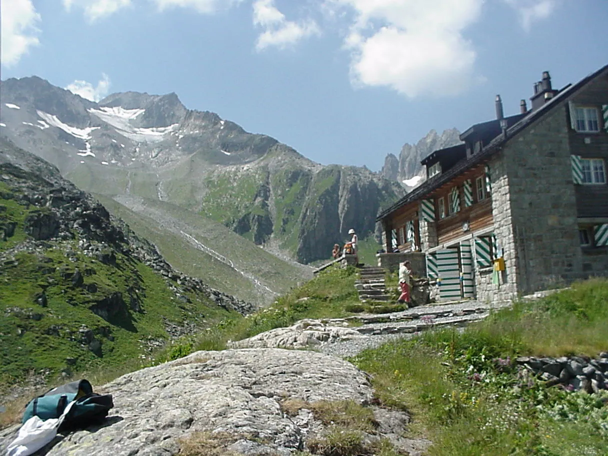 The Etzli hut in the Etzli valley, starting point for the Bristen traverse, with Piz Giuv and a glacier behind.