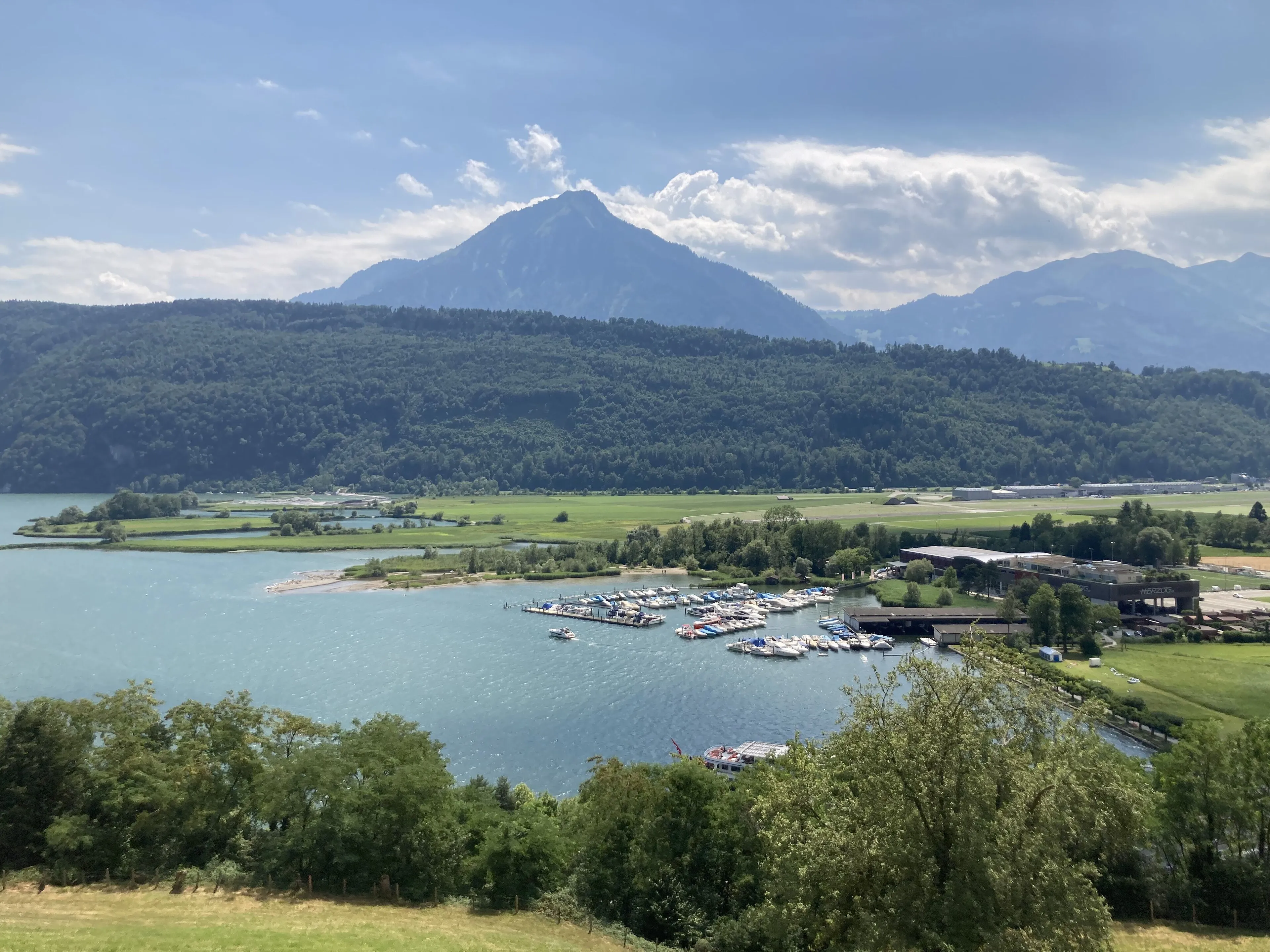 The pyramid of the Stanserhorn beyond Lake Alpnach on a summer day.