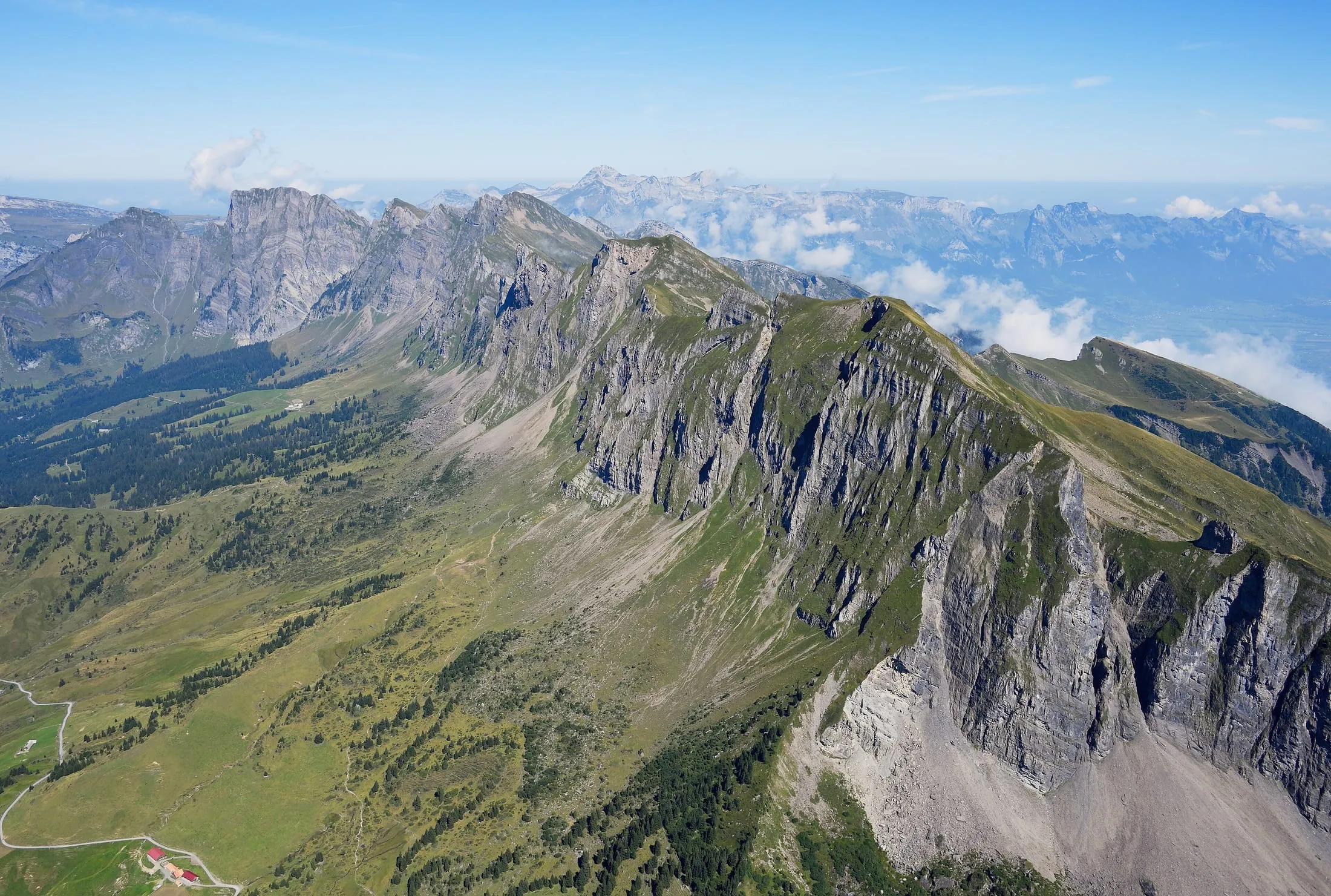 The Alvier group from the air, the grassy summit ridge of the Alvier above steep rock faces.