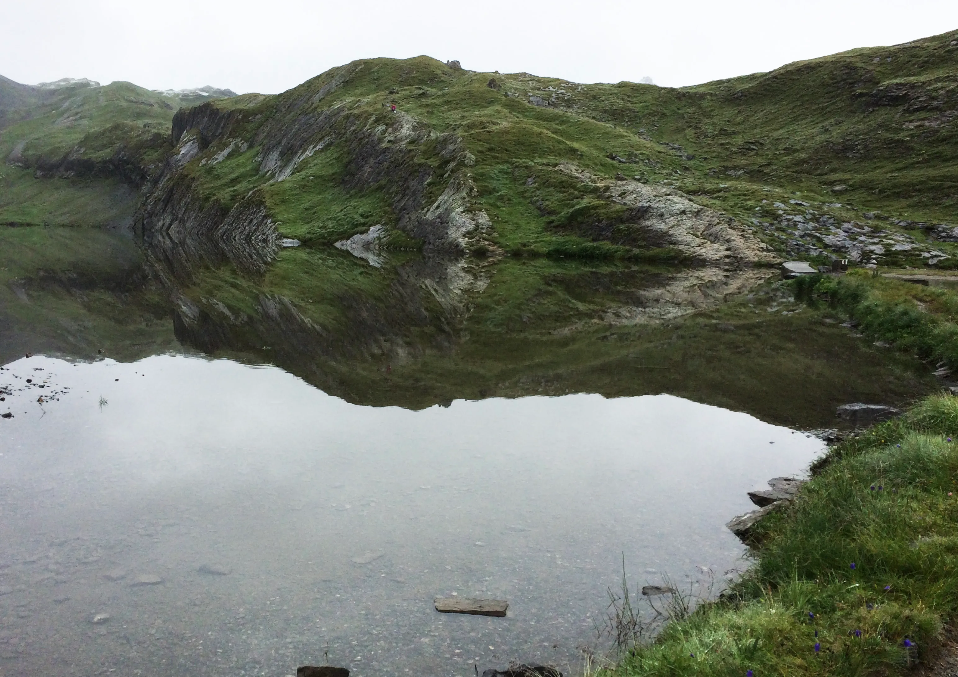 The pale glacial waters of the Lämmerensee in the high basin below the Gemmi and Wildstrubel.