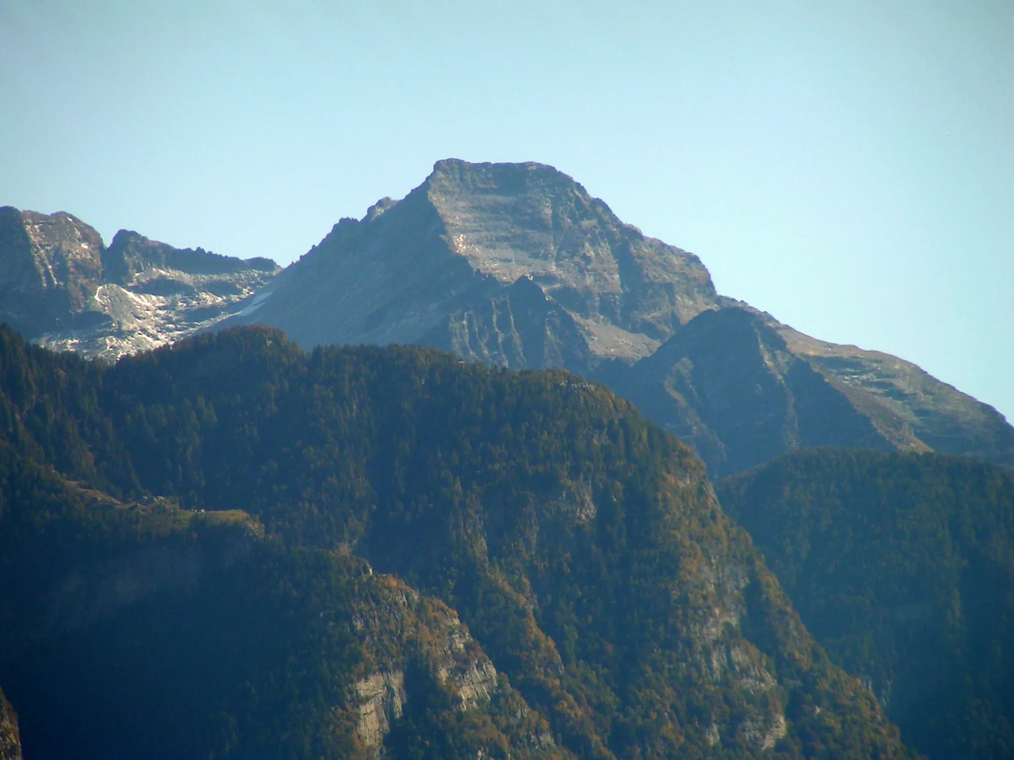 The Pizzo di Claro (2727 m) above the forests of the Riviera valley, from the northwest.