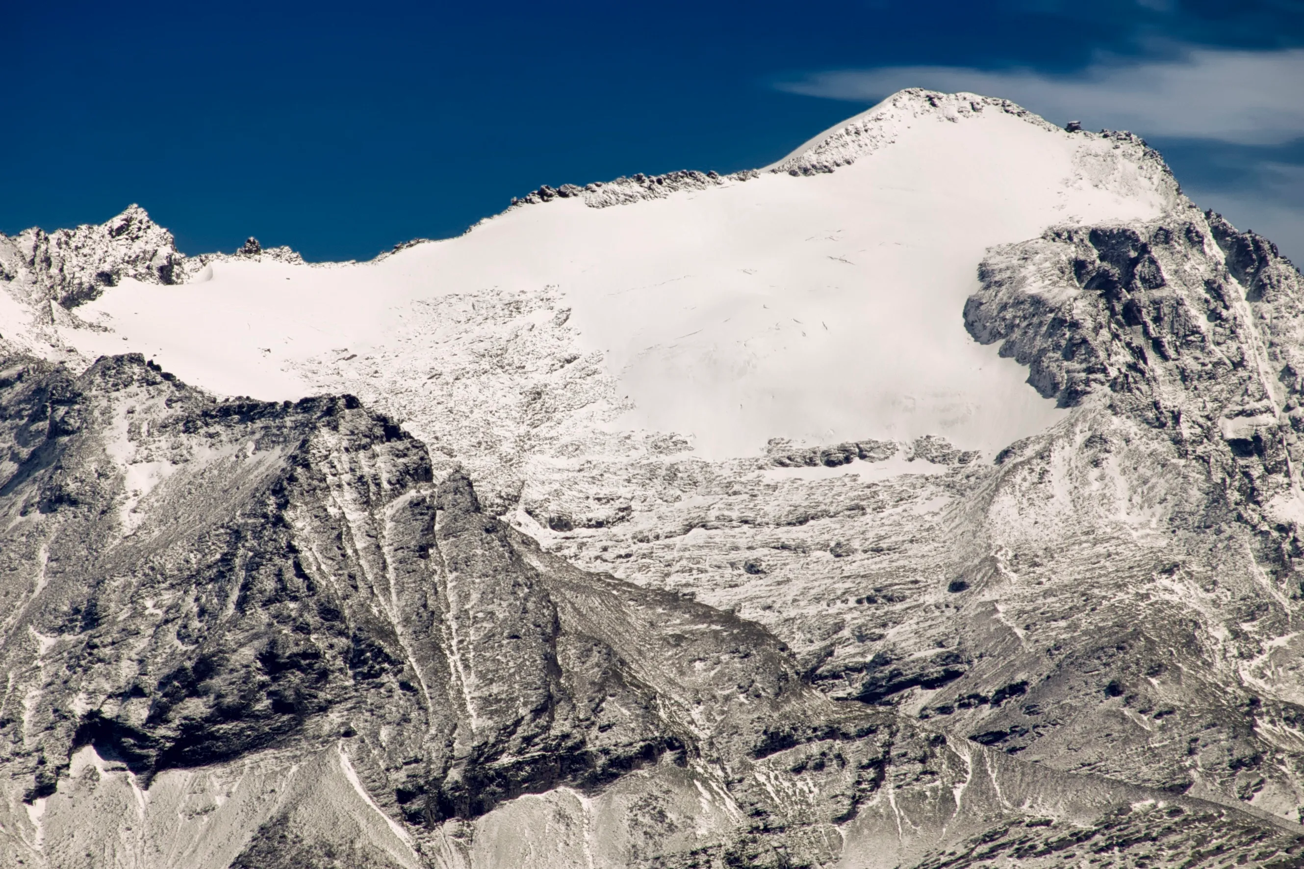 The Rheinwaldhorn (3402 m), highest peak of the Adula, with its snow dome and glacier.