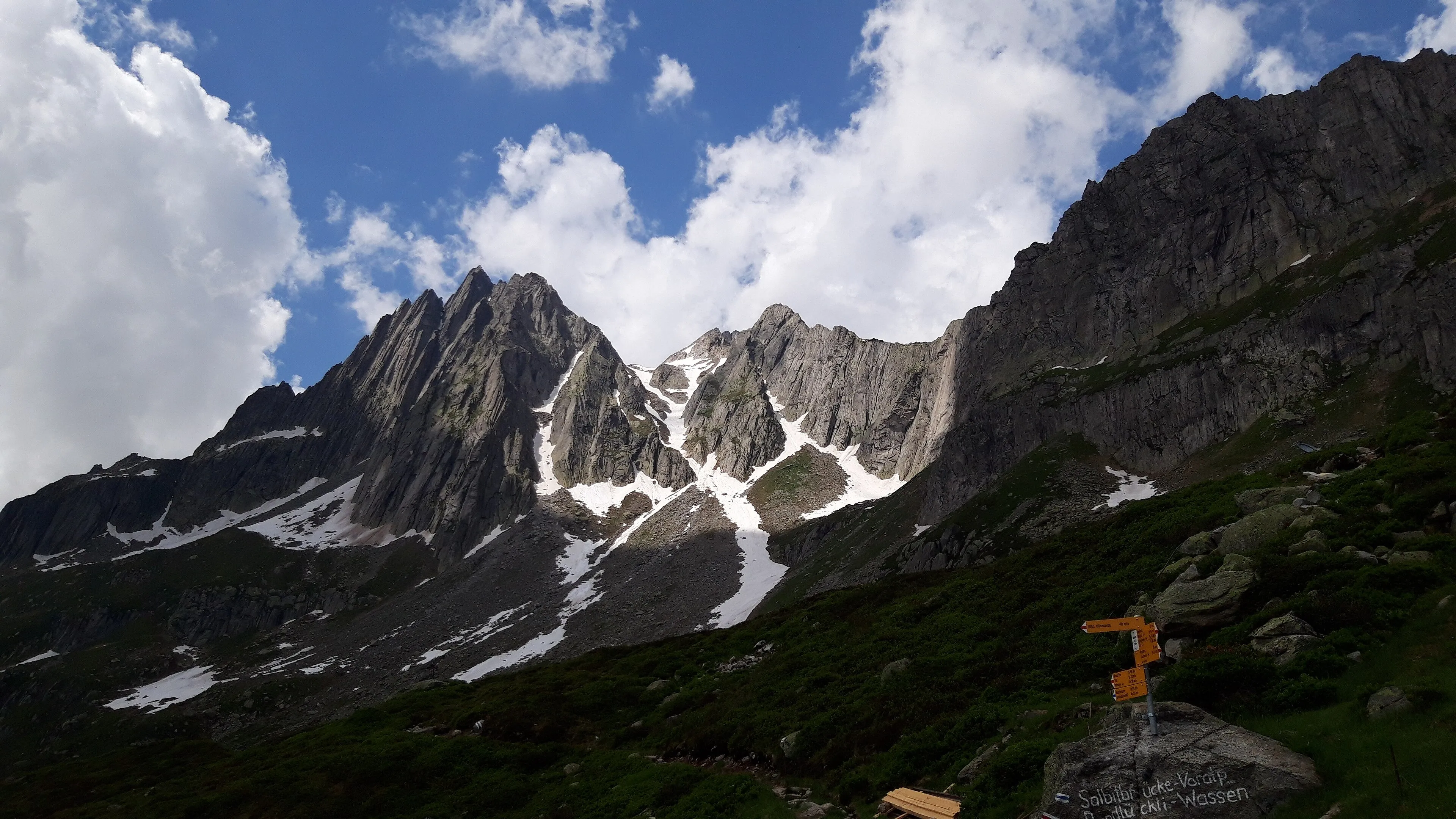 The granite spires of the Salbitschijen above the Salbit hut in the Göschenertal, on a summer day.