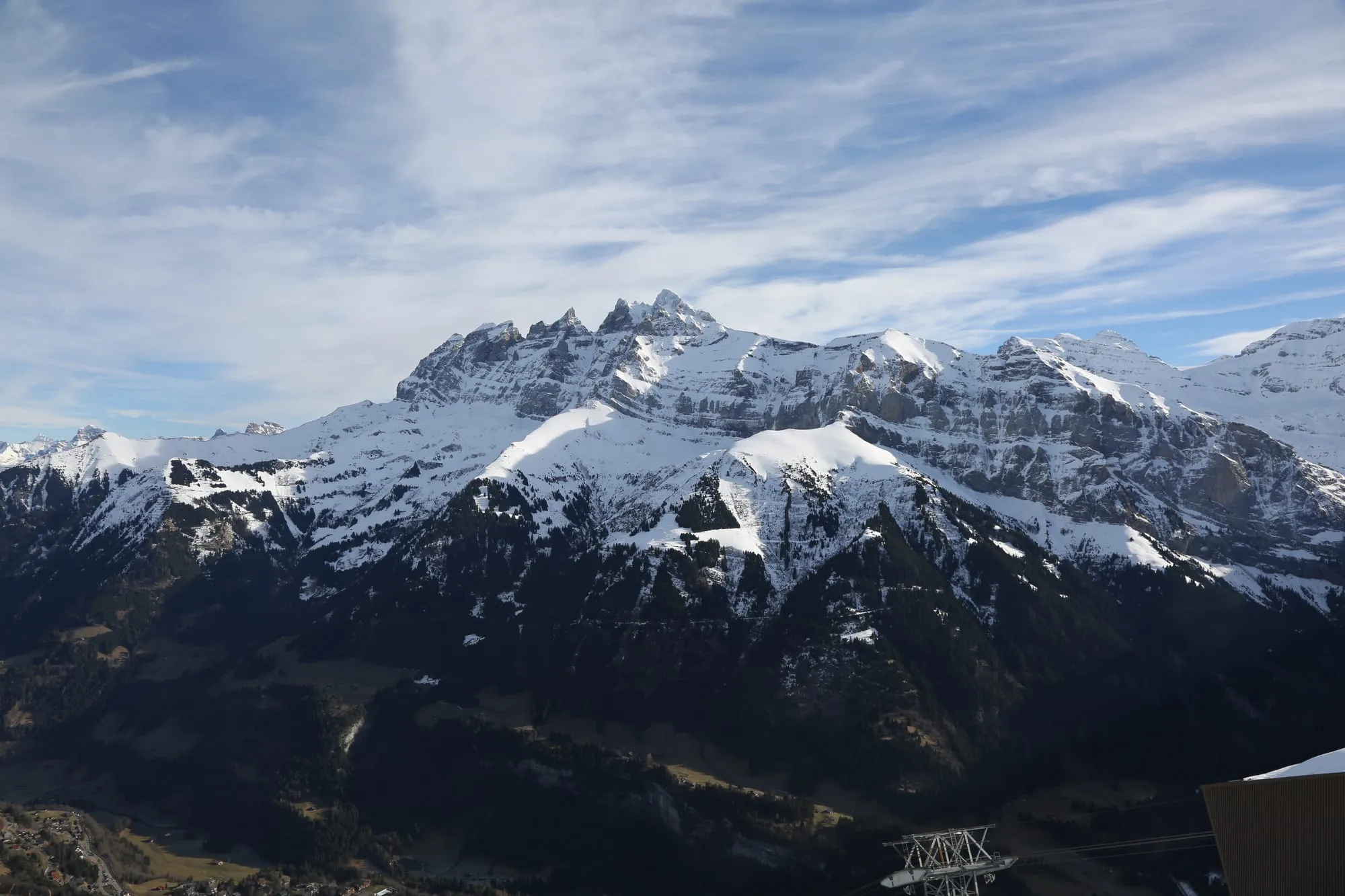 The seven summits of the Dents du Midi rising above green alpine pastures at Planachaux above Champéry.