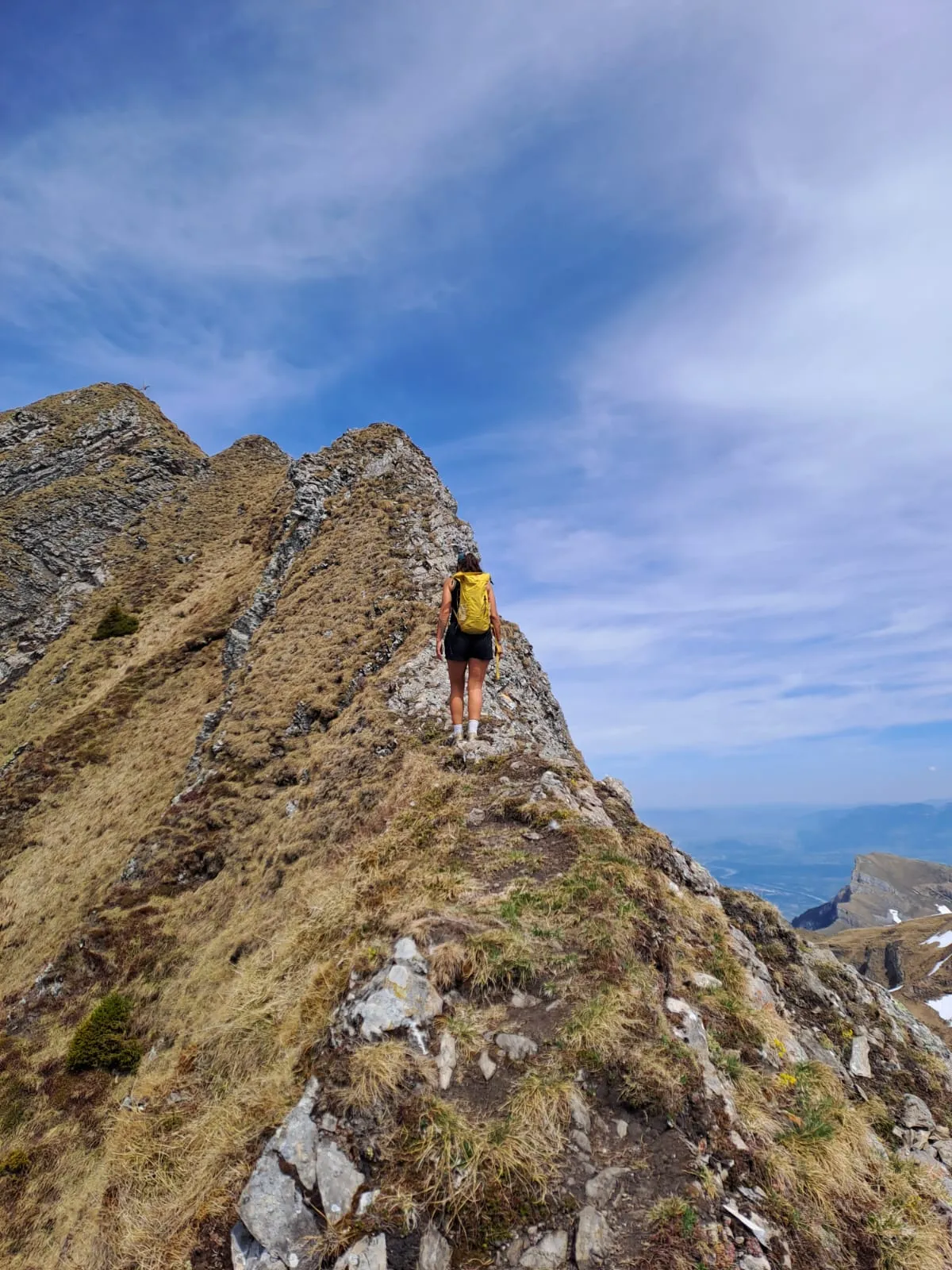 Walking up the narrow grass-and-rock summit ridge of the Sichelchamm.
