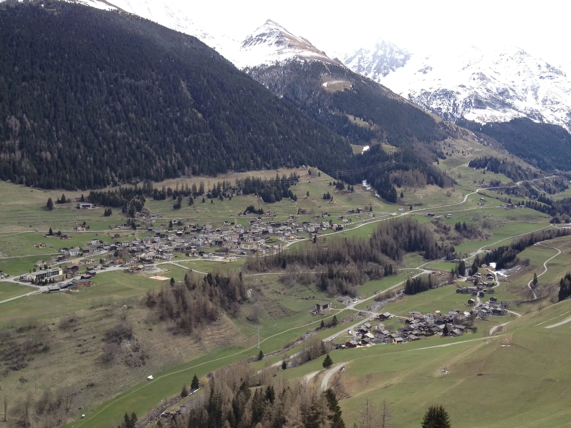 The village of Liddes and its hamlets scattered across the Val d'Entremont, seen from the Roc de Cornet.